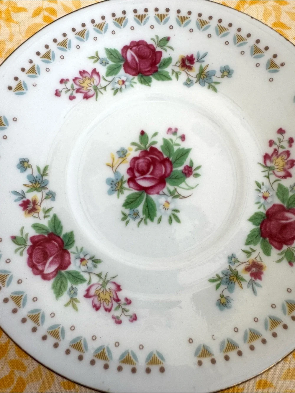 Vintage Espresso Cup and Matching Saucer. White Porcelain with Floral Motif.